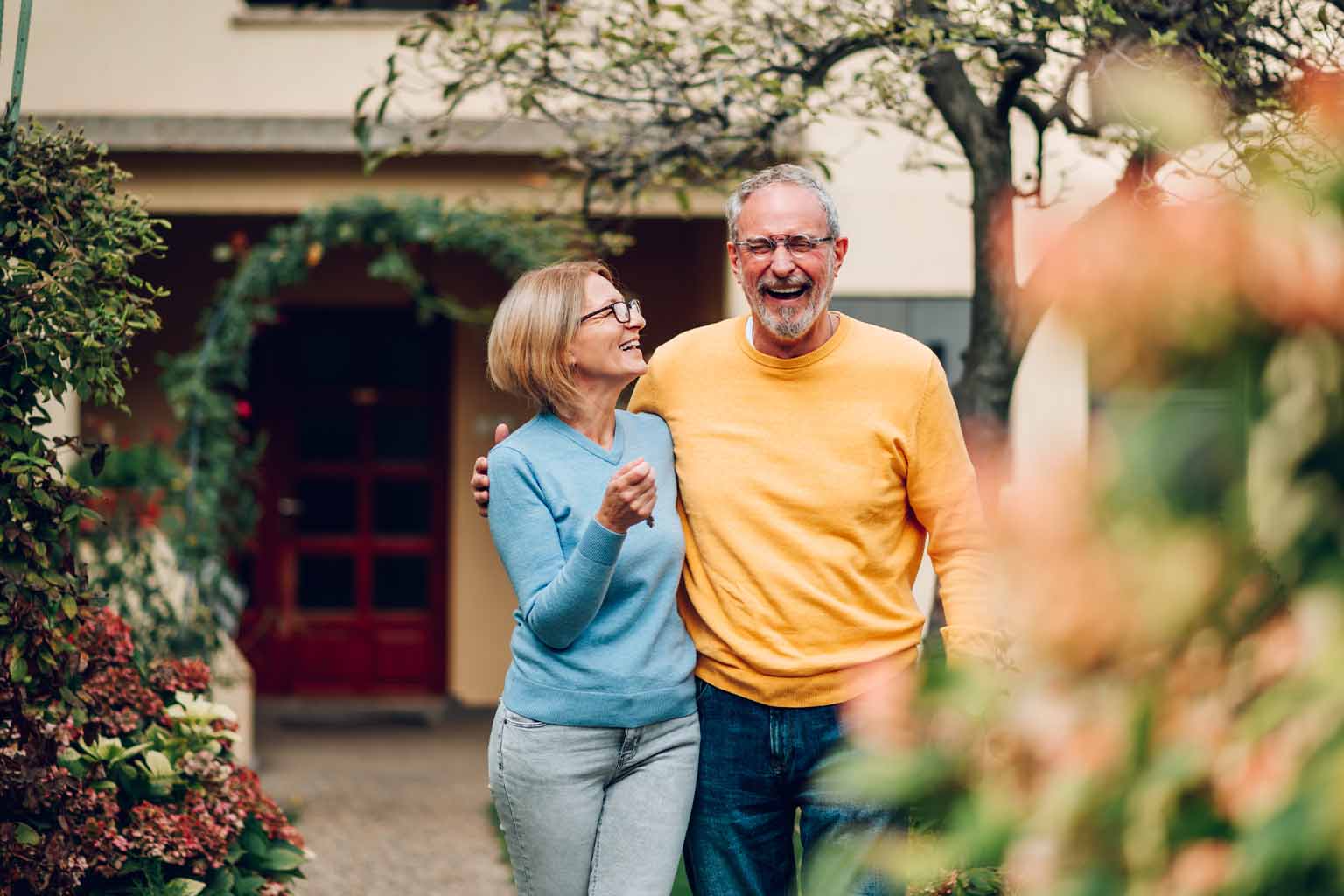 Happy elderly couple enjoying a walk together, symbolizing active aging and recovery through advanced therapies like PRP.